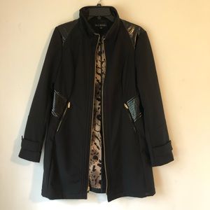 Beautiful jacket with patent leather details.